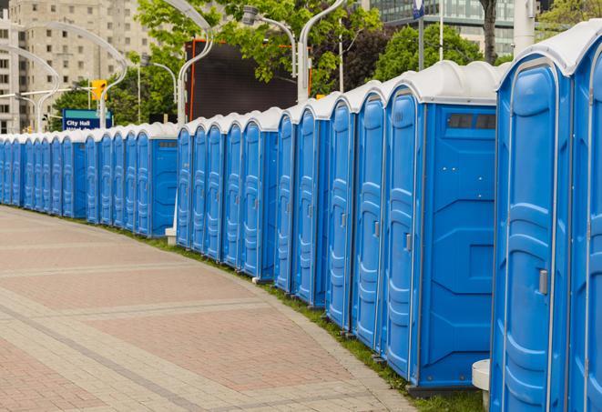 a line of portable restrooms at a sporting event, providing athletes and spectators with clean and accessible facilities in Coral Springs